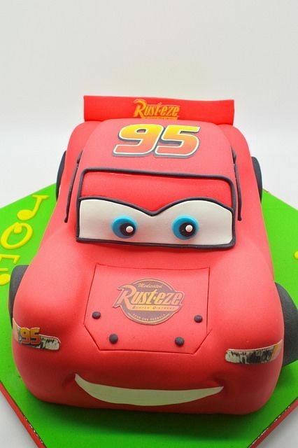 Cars cake design for a birthday~ showing front of cake w/ tire design. 100%  buttercream icing. Shaped car on large shee… | Cars cake design, Car cake, Cake  design